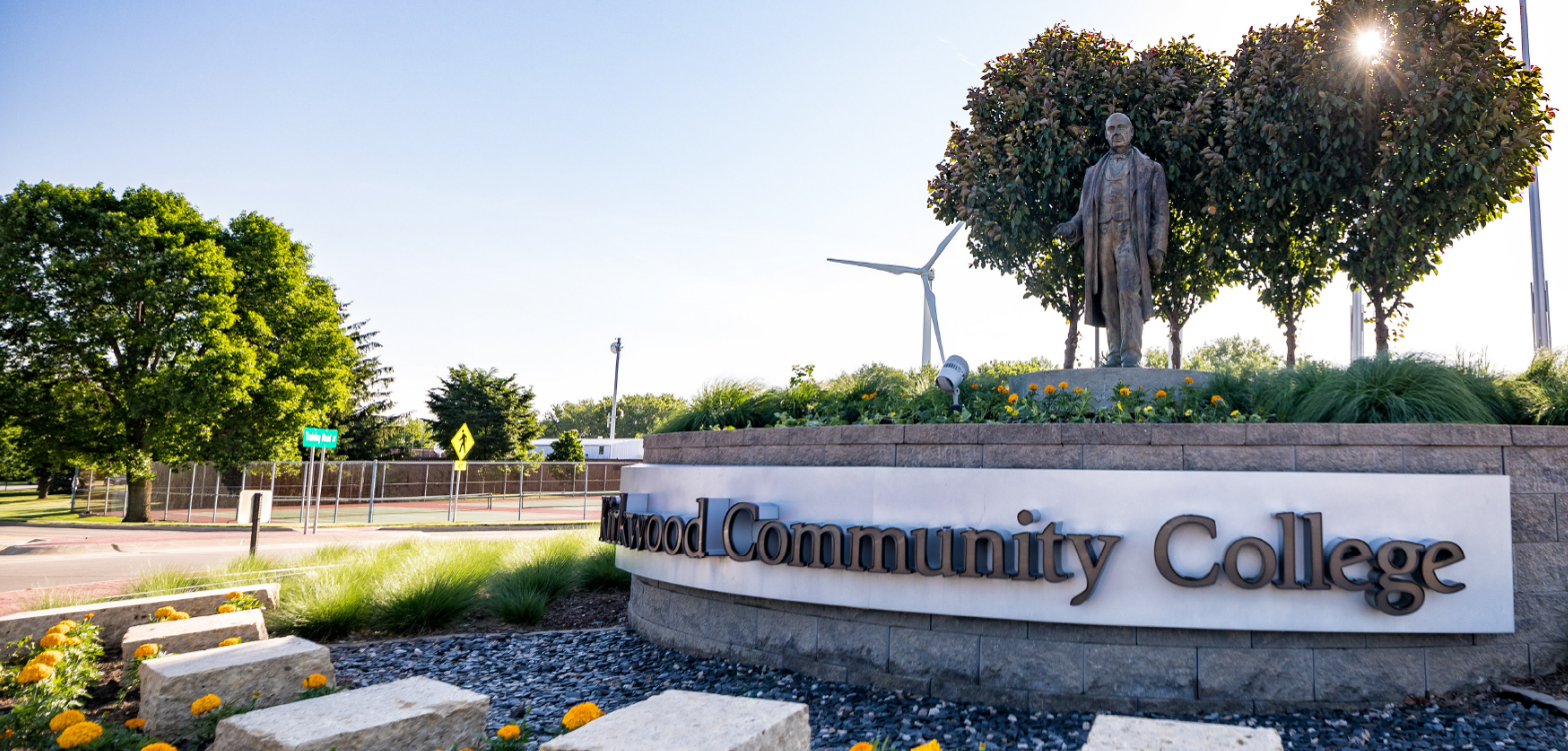 Main entrance of Kirkwood Community College with statue of Samuel Kirkwood.