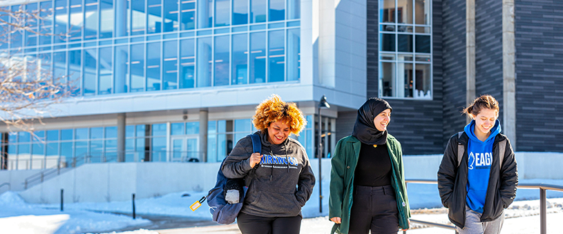 Students walking on campus in winter.