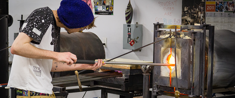 Student in glass making class.